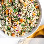 Quinoa salad made with bell pepper, quinoa, parsley, red pepper, cucumber and feta dressing image has recipe title