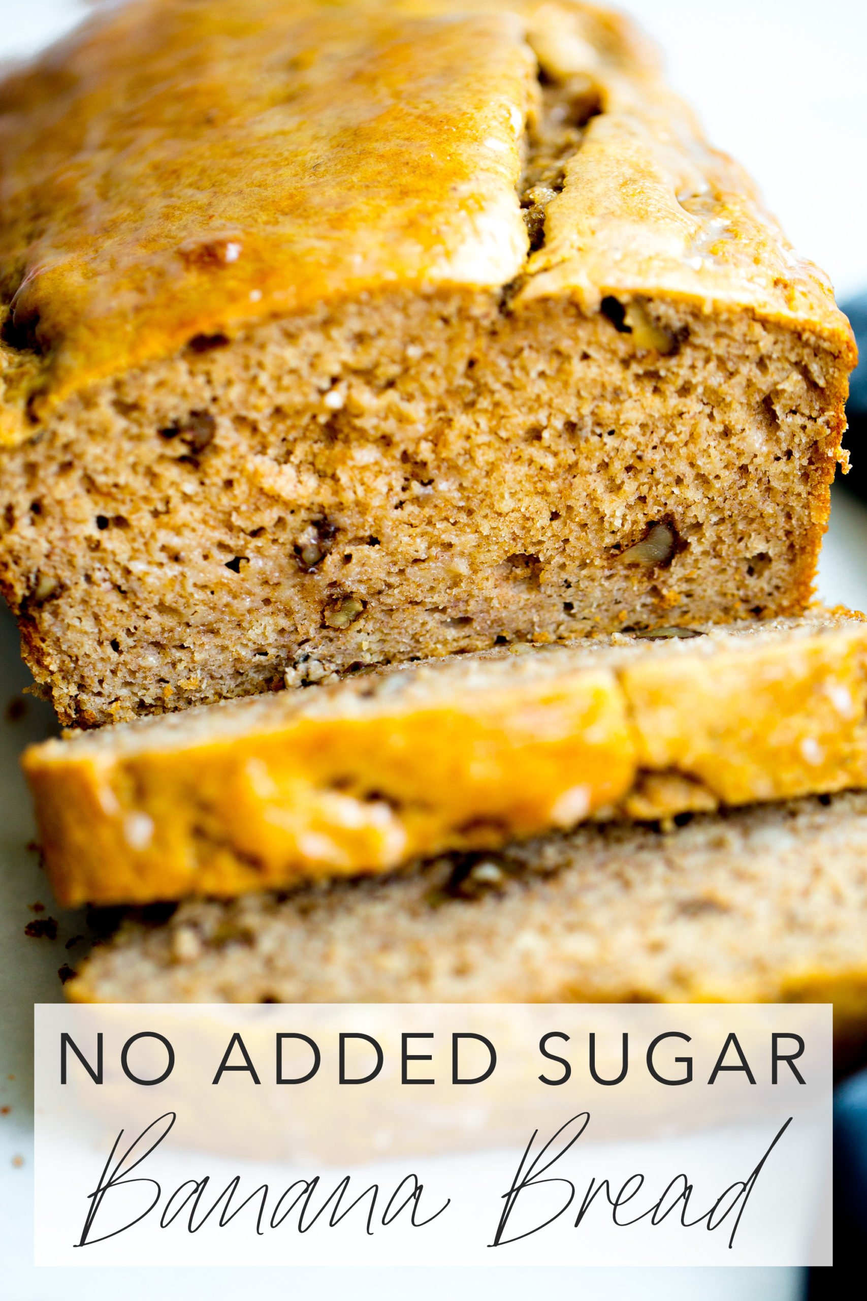 close up photo of a loaf of healthy banana bread with walnuts with title text overlay